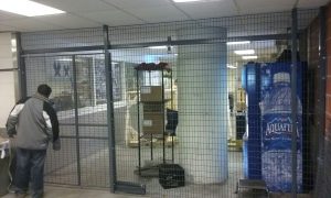 Security cages installed to create perimeter barrier in Daytona. Free Layouts. Sales@LockersUSA.com